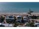 Stunning view of oceanfront properties with sandy beaches, and clear blue waters, perfect for coastal living at 412 S Casey Key Rd, Nokomis, FL 34275