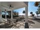Outdoor patio offers shade, dining set and beachfront views at 412 S Casey Key Rd, Nokomis, FL 34275
