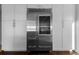 A stainless steel refrigerator is installed within white custom cabinetry at 412 S Casey Key Rd, Nokomis, FL 34275
