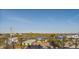 This home features stunning views of the surrounding landscape from a balcony with metal railings at 412 S Casey Key Rd, Nokomis, FL 34275