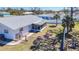 Well-maintained backyard featuring a screened-in lanai and secure black chain link fence at 4120 Shamrock Dr, Venice, FL 34293