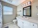 Bathroom featuring vanity, tile floor, and shower/tub combo at 4120 Shamrock Dr, Venice, FL 34293