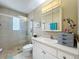 Bathroom featuring tile shower, glass enclosure, vanity, and neutral color scheme at 4120 Shamrock Dr, Venice, FL 34293