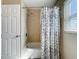 Bright bathroom featuring a shower-tub combo and natural light from the window at 4120 Shamrock Dr, Venice, FL 34293