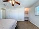 Bedroom featuring a built-in desk and shelving, complemented by neutral walls at 4120 Shamrock Dr, Venice, FL 34293