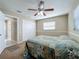 Bedroom featuring a ceiling fan, closet, window, and neutral paint scheme at 4120 Shamrock Dr, Venice, FL 34293