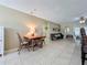 Dining room showcases a quaint table and chairs, bench, and light tan walls at 4120 Shamrock Dr, Venice, FL 34293