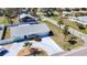 Charming curb appeal, with a well-maintained lawn, mature trees, and concrete driveway at 4120 Shamrock Dr, Venice, FL 34293