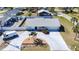 The exterior shows the landscaping surrounding the long, concrete driveway at 4120 Shamrock Dr, Venice, FL 34293