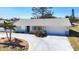 Well-maintained single-story home featuring lush landscaping, a spacious driveway, and inviting curb appeal at 4120 Shamrock Dr, Venice, FL 34293