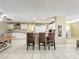 Modern kitchen featuring bar seating, white cabinets, and lots of countertop space at 4120 Shamrock Dr, Venice, FL 34293