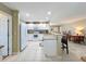 Modern kitchen featuring bar seating, white cabinets, and stainless steel appliances at 4120 Shamrock Dr, Venice, FL 34293