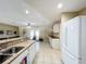 Spacious kitchen with granite counters, white cabinets and adjacent dining area at 4120 Shamrock Dr, Venice, FL 34293