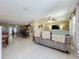 Open concept living room and dining area with tile floors and neutral paint scheme at 4120 Shamrock Dr, Venice, FL 34293