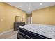 Bedroom featuring a ceiling fan, dresser with a mirror and a gray bed frame with a patterned mattress set at 4331 Turnberry Cir, North Port, FL 34288