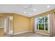 Bright bedroom with neutral walls, a ceiling fan, and light gray flooring at 4331 Turnberry Cir, North Port, FL 34288
