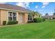 Charming single-story home with well-manicured lawn and tropical landscaping at 4331 Turnberry Cir, North Port, FL 34288