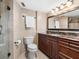 Tiled bathroom featuring a dark wood vanity with marble countertop and shower at 435 S Gulfstream Ave # 601, Sarasota, FL 34236