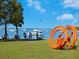 Scenic bayfront view featuring art installation, people relaxing, and boats on the water under a blue sky at 435 S Gulfstream Ave # 601, Sarasota, FL 34236