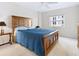 Comfortable bedroom with a plush blue comforter and natural light from the window at 435 S Gulfstream Ave # 601, Sarasota, FL 34236