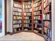 Floor-to-ceiling custom bookshelves showcasing an extensive collection of books, enhancing the room's sophisticated aesthetic at 435 S Gulfstream Ave # 601, Sarasota, FL 34236