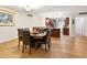 Dining room with a wooden table, leather chairs, and access to the kitchen at 435 S Gulfstream Ave # 601, Sarasota, FL 34236