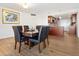 Elegant dining area with a wooden table, leather chairs, and an open layout flowing into the modern kitchen at 435 S Gulfstream Ave # 601, Sarasota, FL 34236
