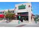 The Whole Foods Market building featuring brick facade with green awning and sidewalk at 435 S Gulfstream Ave # 601, Sarasota, FL 34236