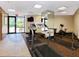 Community gym with various exercise equipment, including a treadmill, stationary bike, and free weights, promoting a healthy lifestyle at 435 S Gulfstream Ave # 601, Sarasota, FL 34236