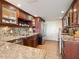 Beautiful kitchen with stainless steel appliances, custom wood cabinetry, and granite countertops at 435 S Gulfstream Ave # 601, Sarasota, FL 34236