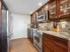 Lovely kitchen with stainless steel appliances, custom wood cabinetry, and granite countertops at 435 S Gulfstream Ave # 601, Sarasota, FL 34236