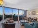 Bright living room with expansive views, comfortable seating and stylish decor for relaxing and enjoying the scenery at 435 S Gulfstream Ave # 601, Sarasota, FL 34236