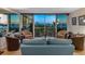 Open-concept living room with floor-to-ceiling windows offering panoramic water views, blending indoor and outdoor living spaces at 435 S Gulfstream Ave # 601, Sarasota, FL 34236
