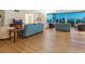 Bright living room with wood floors, a blue sofa set, and views of the water at 435 S Gulfstream Ave # 601, Sarasota, FL 34236