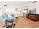 Cozy living room with a fireplace, entertainment center, and comfortable seating arrangements at 435 S Gulfstream Ave # 601, Sarasota, FL 34236