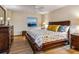 Cozy bedroom with wood floors, a decorative bed, and a window view of the water at 435 S Gulfstream Ave # 601, Sarasota, FL 34236