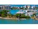 Beautiful marina with a variety of boats and yachts docked in pristine blue water with stunning city views at 435 S Gulfstream Ave # 601, Sarasota, FL 34236
