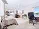 Bright office with large windows, a ceiling fan, a desk, and a comfortable bed at 435 S Gulfstream Ave # 601, Sarasota, FL 34236