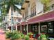 Charming storefronts with awnings, potted plants, and a pedestrian-friendly street at 435 S Gulfstream Ave # 601, Sarasota, FL 34236