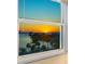 Beautiful water view with palm trees at sunset at 435 S Gulfstream Ave # 601, Sarasota, FL 34236