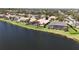 Aerial view of waterfront homes with screened lanais and beautifully landscaped yards at 4901 Sabal Lake Cir, Sarasota, FL 34238