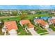 Aerial view of a home on a golf course with lush green fairways and manicured landscaping at 4909 Clubview E Ct, Bradenton, FL 34203