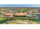 Overhead view of the community clubhouse and pool, highlighting the golf course and tennis courts at 4909 Clubview E Ct, Bradenton, FL 34203