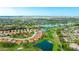 Stunning aerial view of a community featuring a golf course, and beautiful pond at 4909 Clubview E Ct, Bradenton, FL 34203