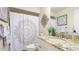 Stylish bathroom with granite countertop, decorative accents, and a shower at 4909 Clubview E Ct, Bradenton, FL 34203