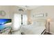 Light-filled bedroom features neutral decor, vaulted ceiling, and bright windows at 4909 Clubview E Ct, Bradenton, FL 34203