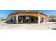 Clubhouse entrance with outdoor seating and views of the community at 4909 Clubview E Ct, Bradenton, FL 34203