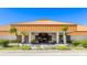 Beautiful clubhouse exterior with manicured landscaping and inviting entrance at 4909 Clubview E Ct, Bradenton, FL 34203