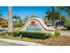 Welcoming Peridia community sign with lush landscaping and clear blue skies at 4909 Clubview E Ct, Bradenton, FL 34203