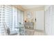 Inviting foyer featuring a console table, tile floors, a front door, and a coat closet at 4909 Clubview E Ct, Bradenton, FL 34203